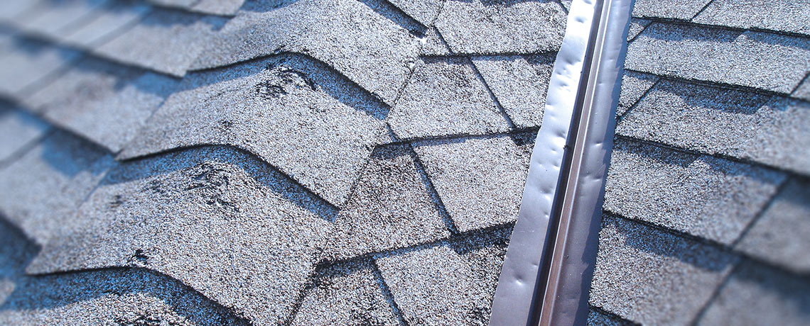 Example of a roof that has sustained hail damage. If your roof looks like this contact our OKC Roofing Company.